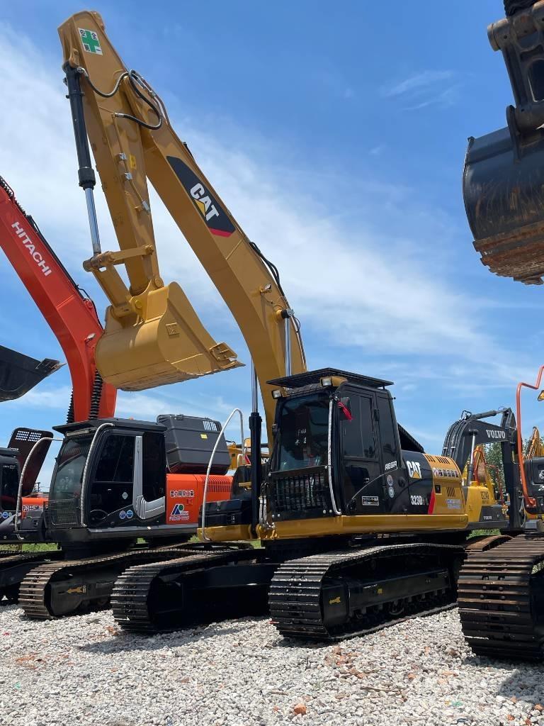 CAT 323 Гусеничні екскаватори