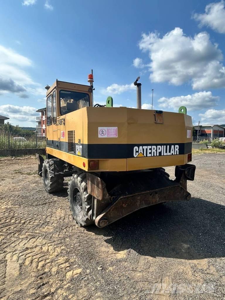 CAT 214 Колісні екскаватори