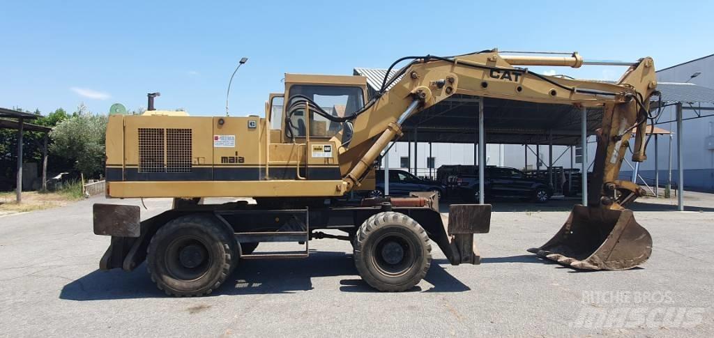 CAT 214 B Колісні екскаватори