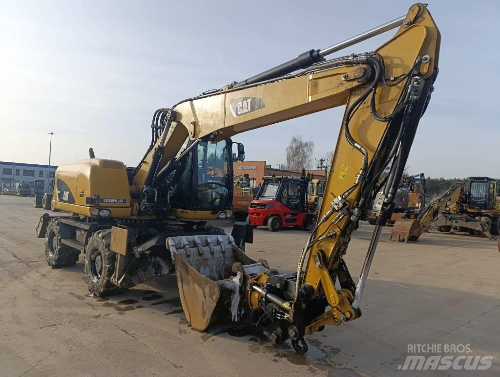 CAT M 313 D Колісні екскаватори