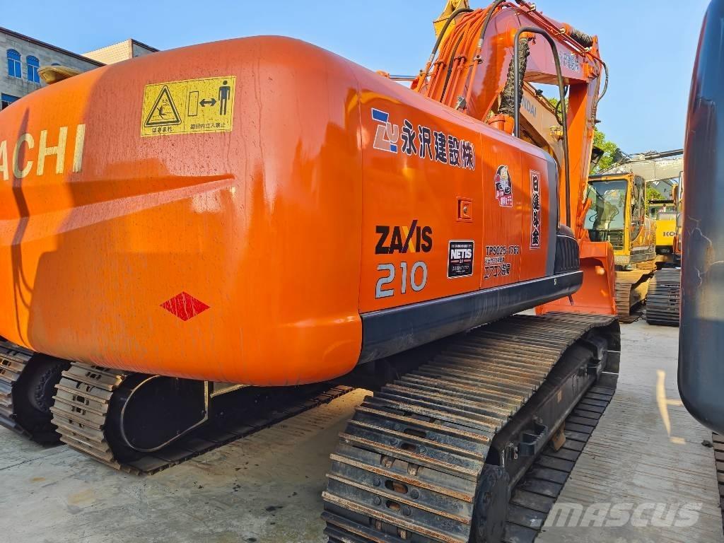 Hitachi ZX 210 Гусеничні екскаватори