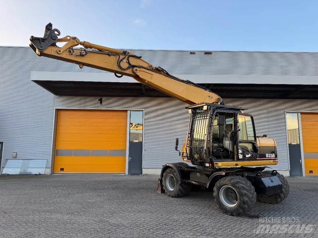 CAT M315C Колісні екскаватори