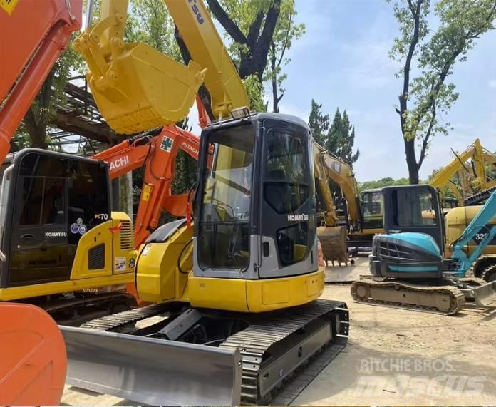 Komatsu PC78US Середні екскаватори 7т. - 12т.