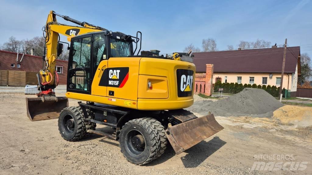 CAT M 315 F Колісні екскаватори