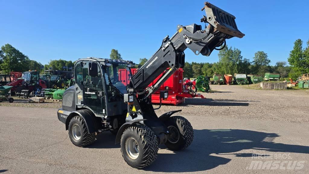 Weidemann 2080Tele Багатофункціональне обладнання для вантажних і землекопальних робіт