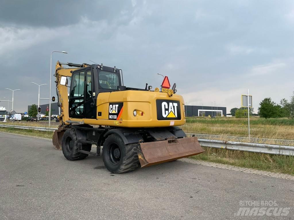 CAT M313D - CE Колісні екскаватори