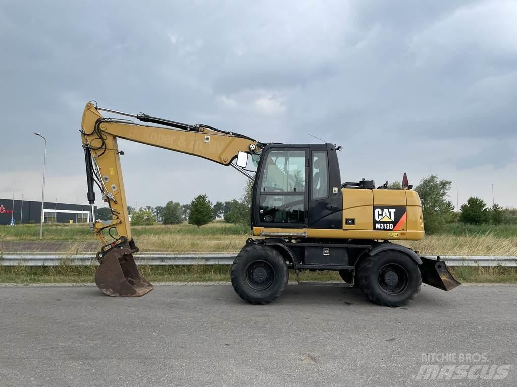 CAT M313D - CE Колісні екскаватори