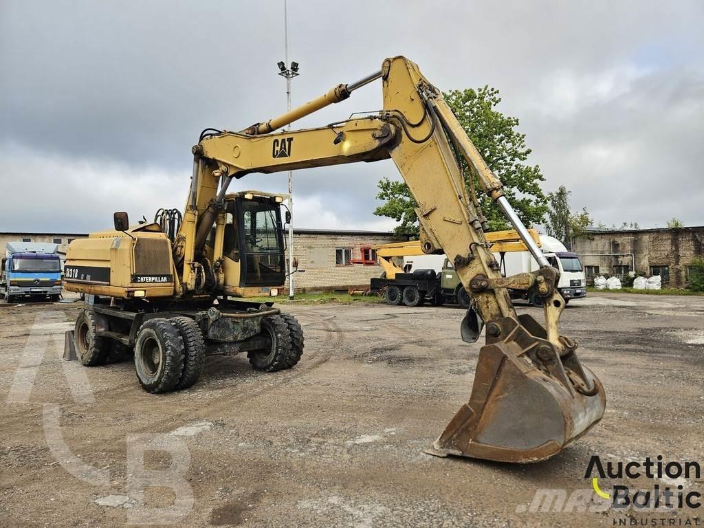CAT M 318 C Колісні екскаватори