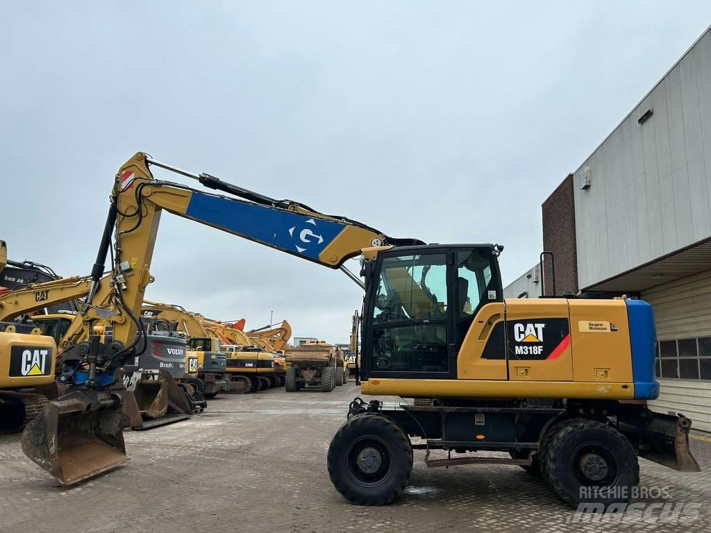 CAT M 318 F Колісні екскаватори