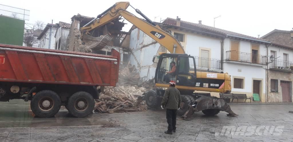 CAT M318d Колісні екскаватори