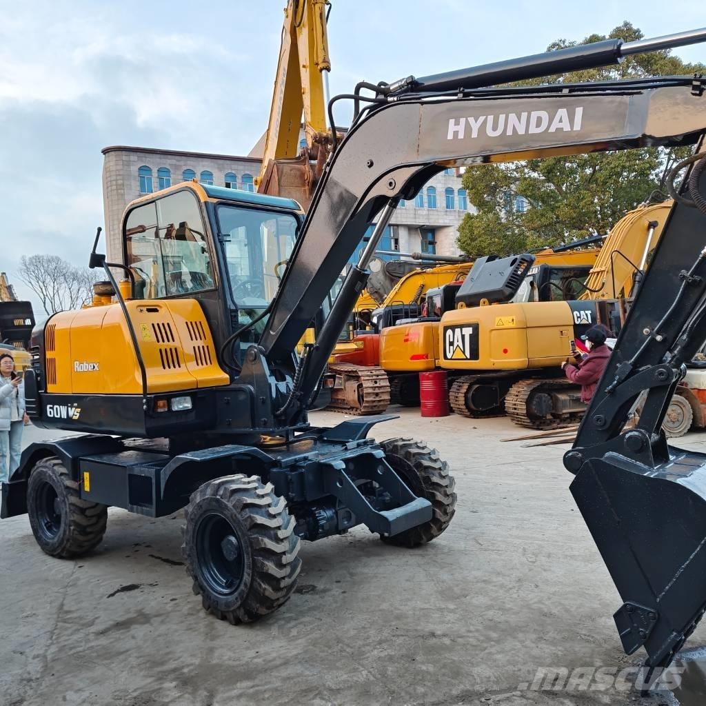 Hyundai 60 W VS Колісні екскаватори