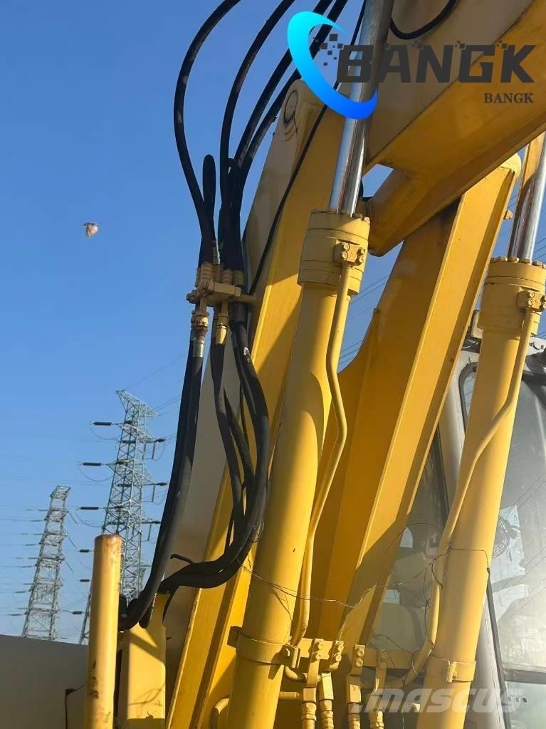  KOMΛ1'SU PW128us Колісні екскаватори