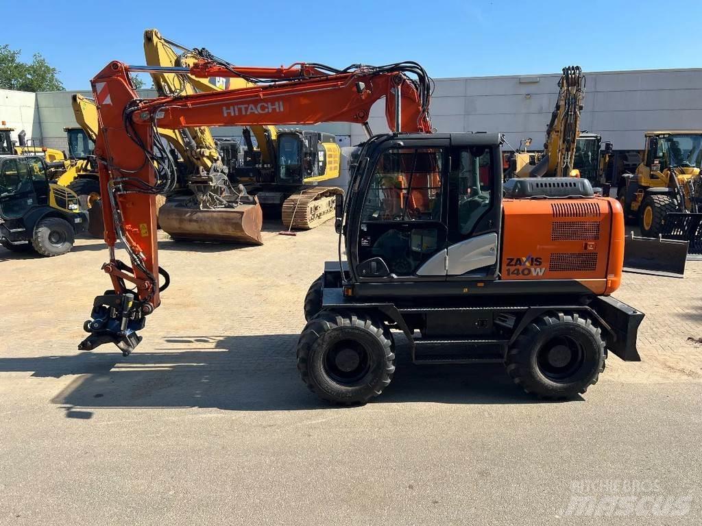 Hitachi 140W Колісні екскаватори