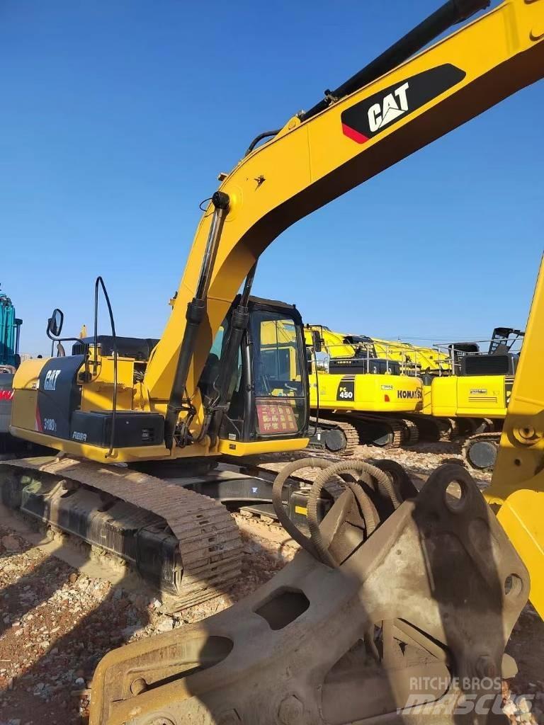 CAT 318 Гусеничні екскаватори