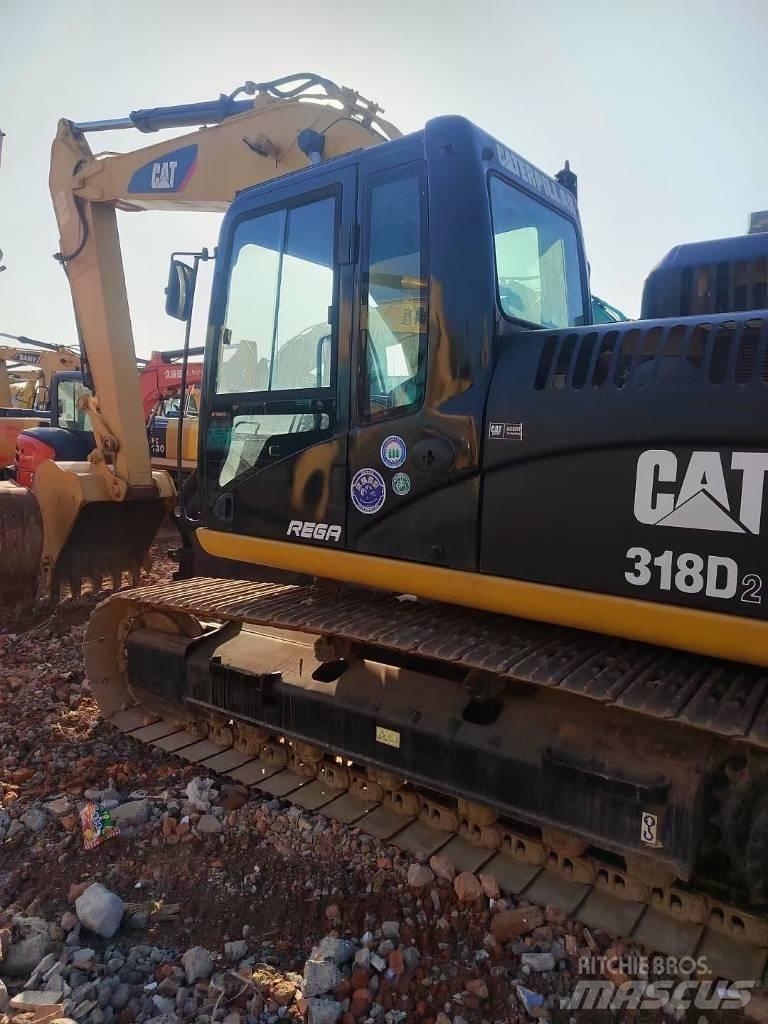 CAT 318 Гусеничні екскаватори
