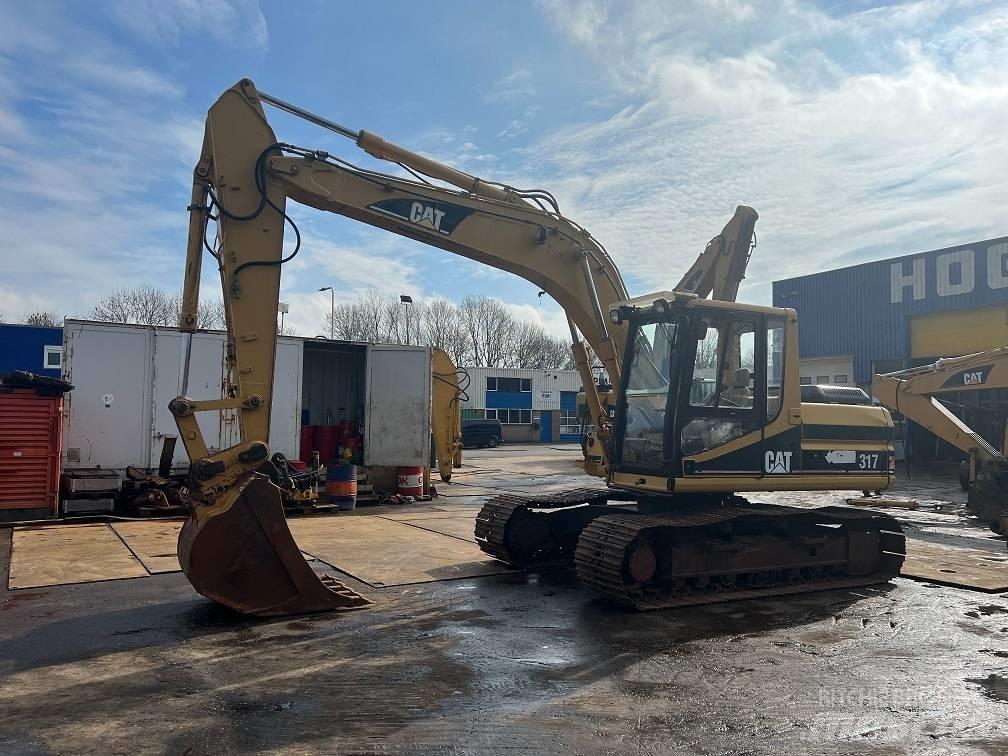 CAT 317 Гусеничні екскаватори