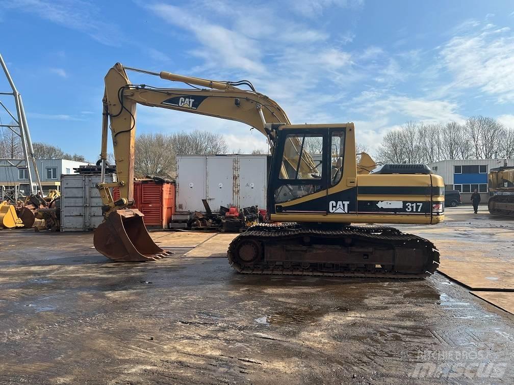 CAT 317 Гусеничні екскаватори