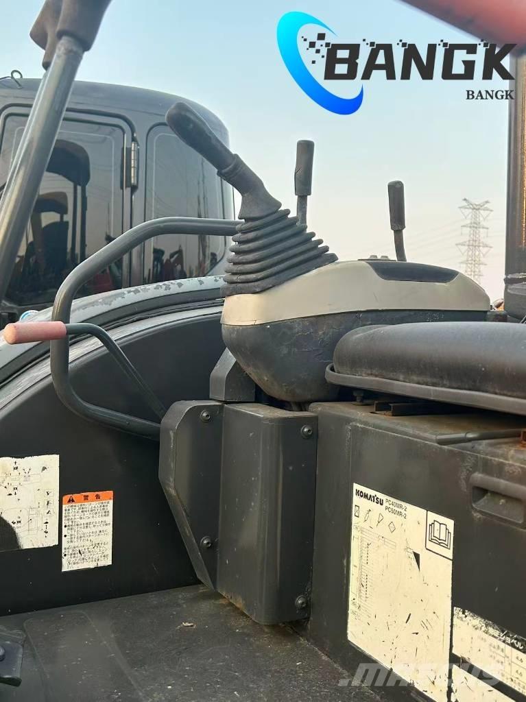  KOMΛ1‘SU PC40-MR Гусеничні екскаватори