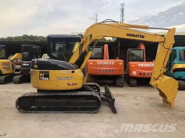 Komatsu PC78US Середні екскаватори 7т. - 12т.