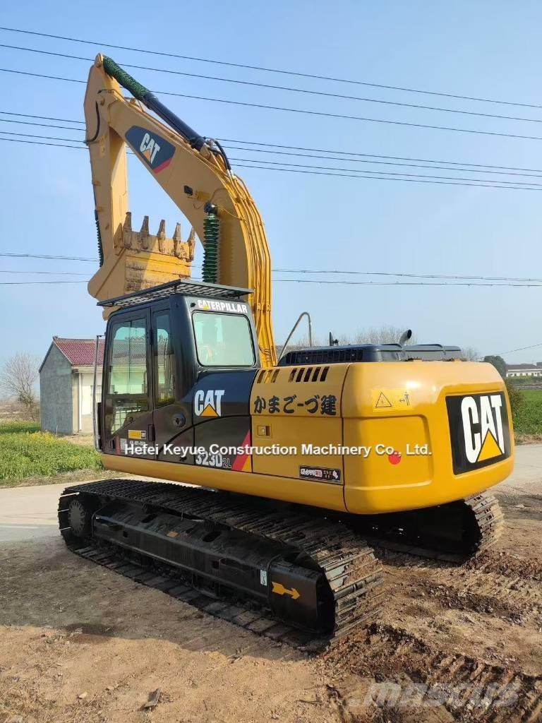 CAT 323 Гусеничні екскаватори