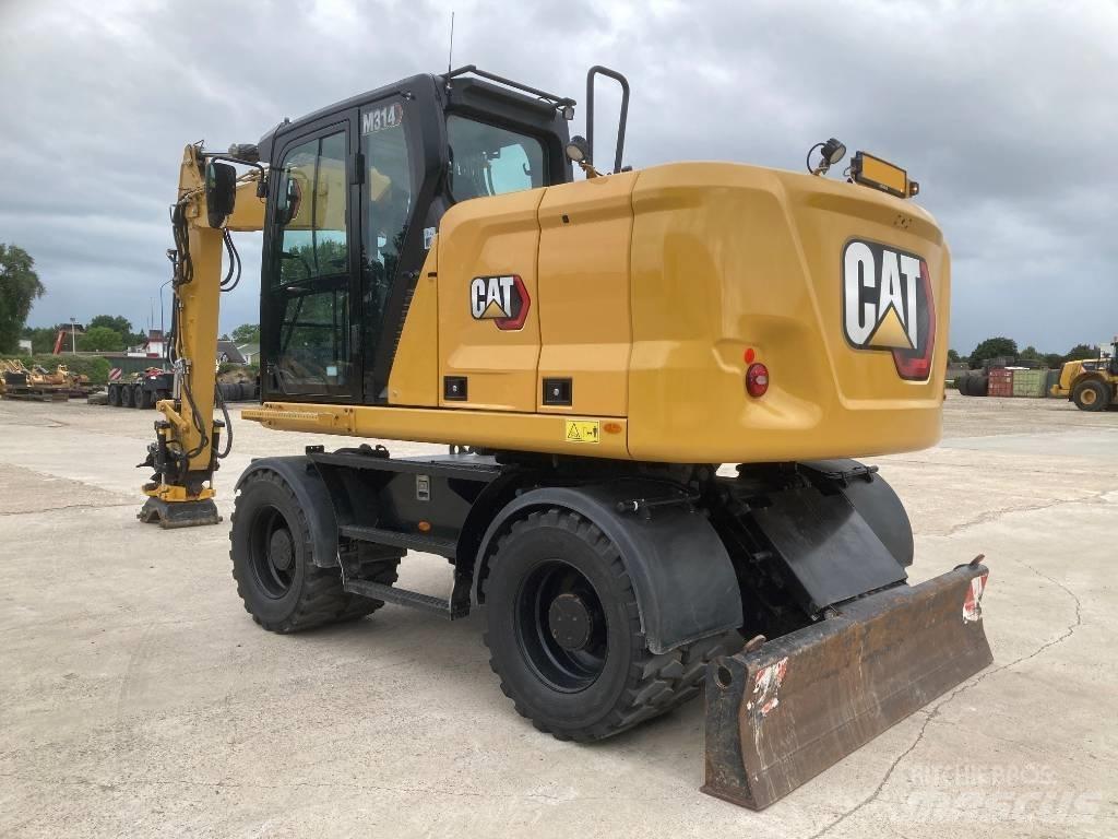 CAT M314 Колісні екскаватори