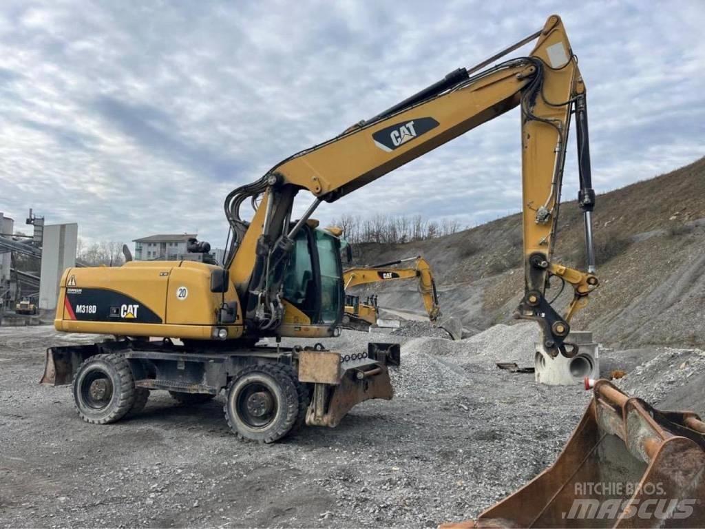 CAT M318D Колісні екскаватори