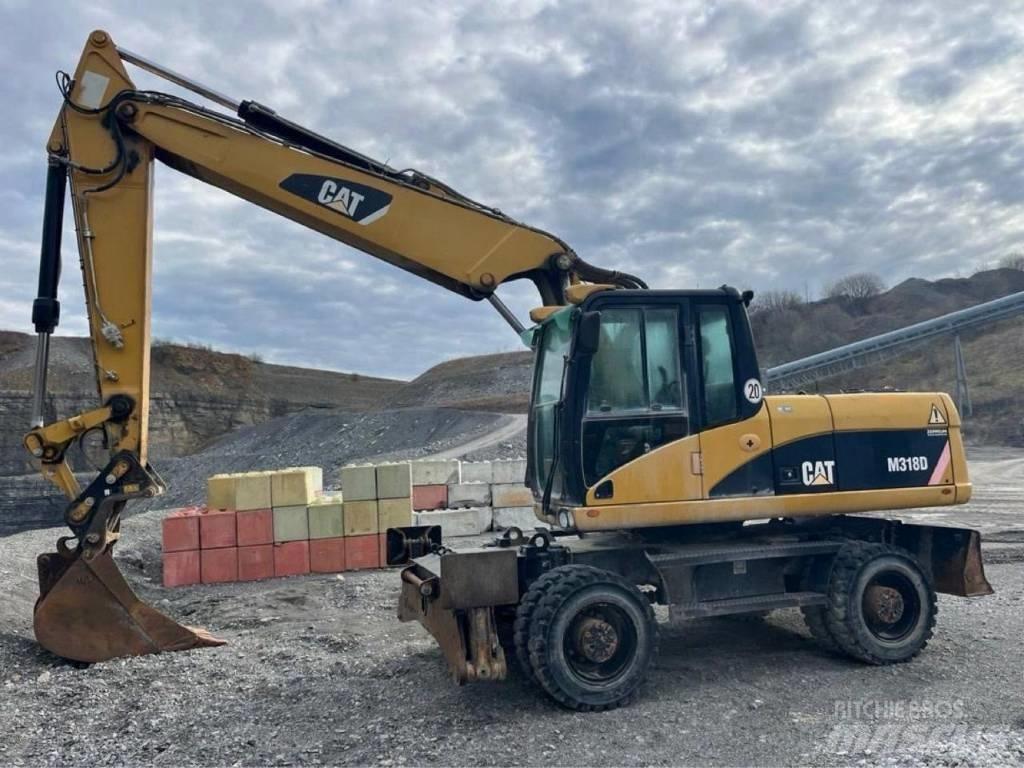 CAT M318D Колісні екскаватори