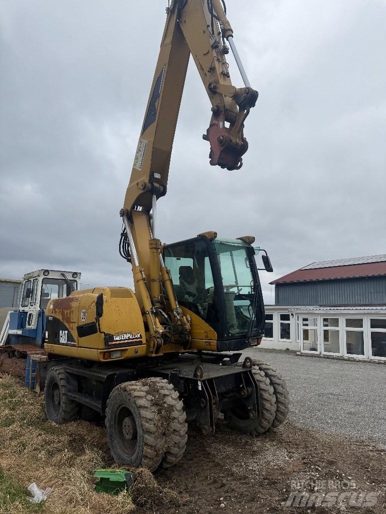 CAT M 313 C Колісні екскаватори