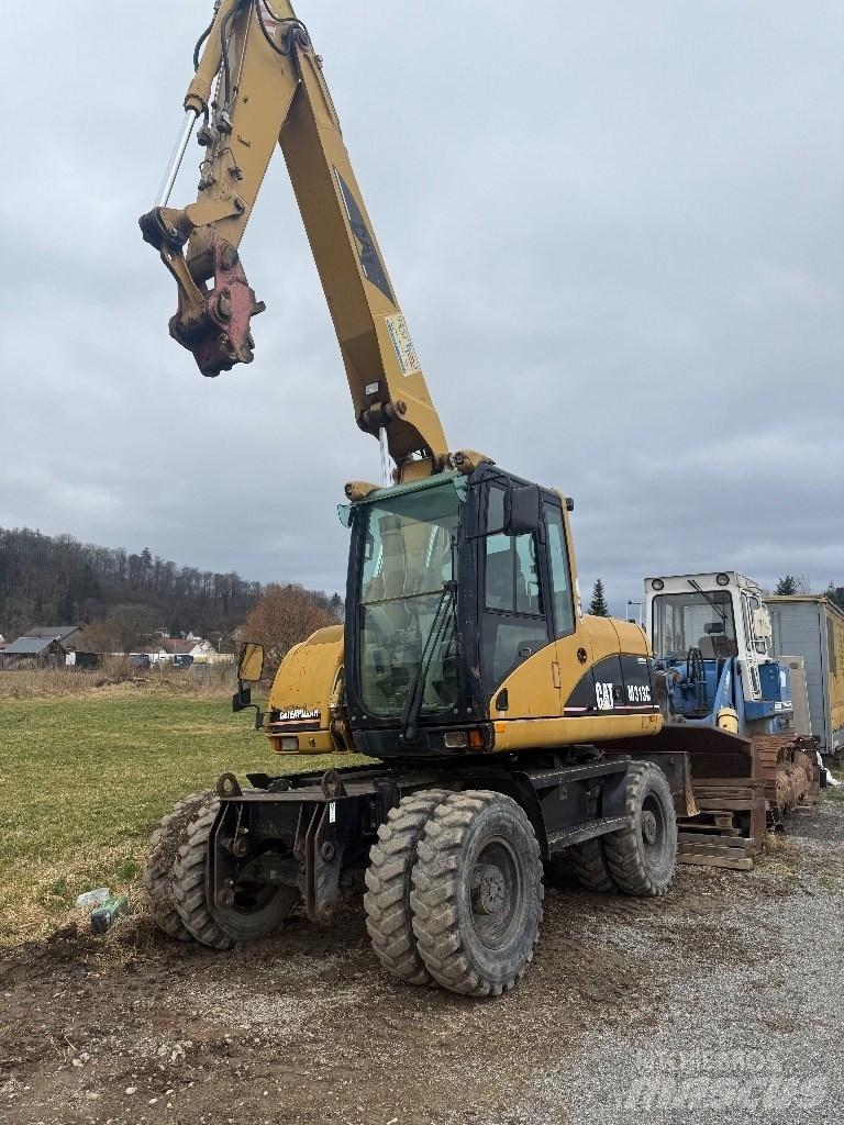 CAT M 313 C Колісні екскаватори