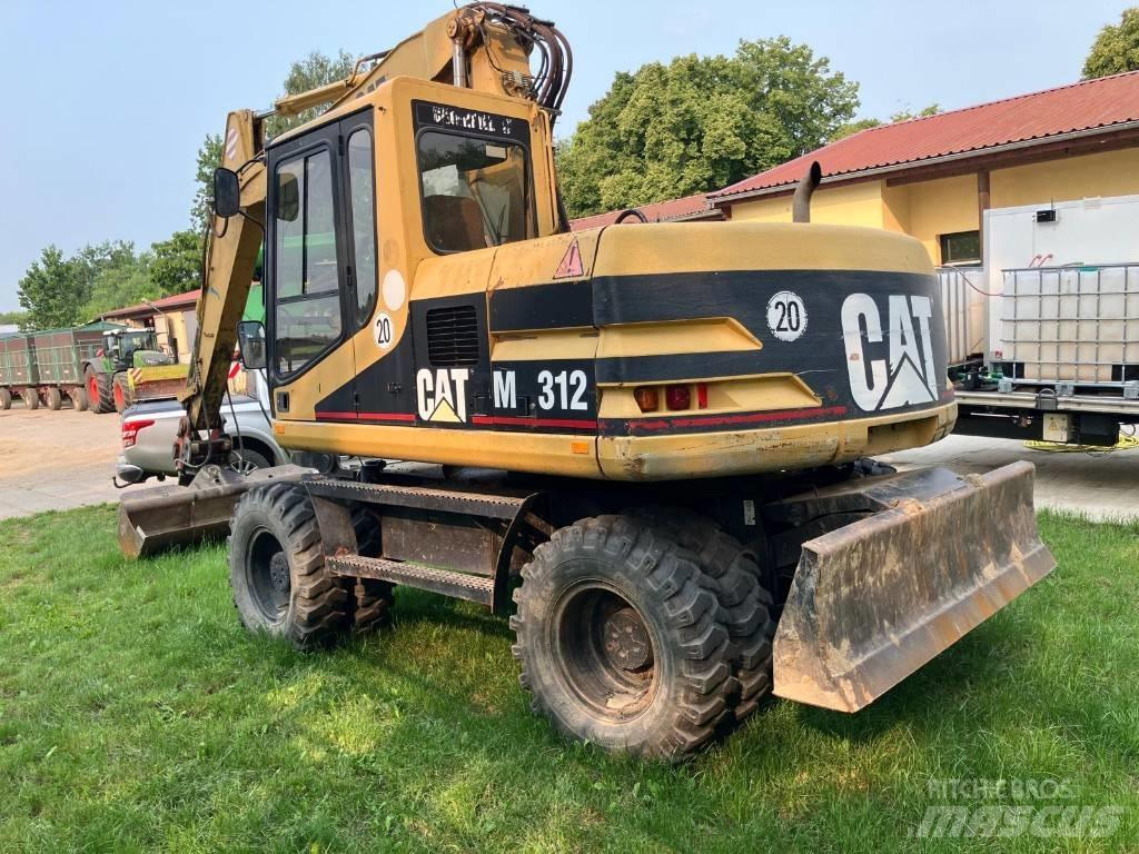 CAT M 312 Колісні екскаватори