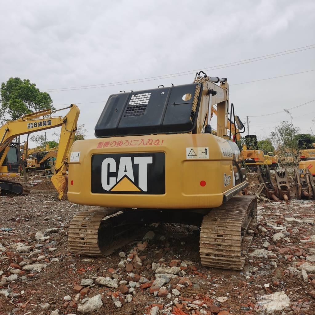 CAT 323DL Гусеничні екскаватори
