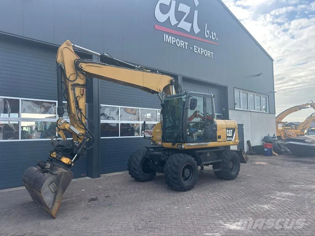 CAT M313D Колісні екскаватори