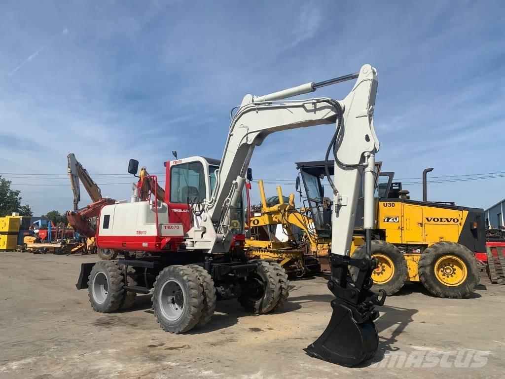 Takeuchi TB070W Колісні екскаватори