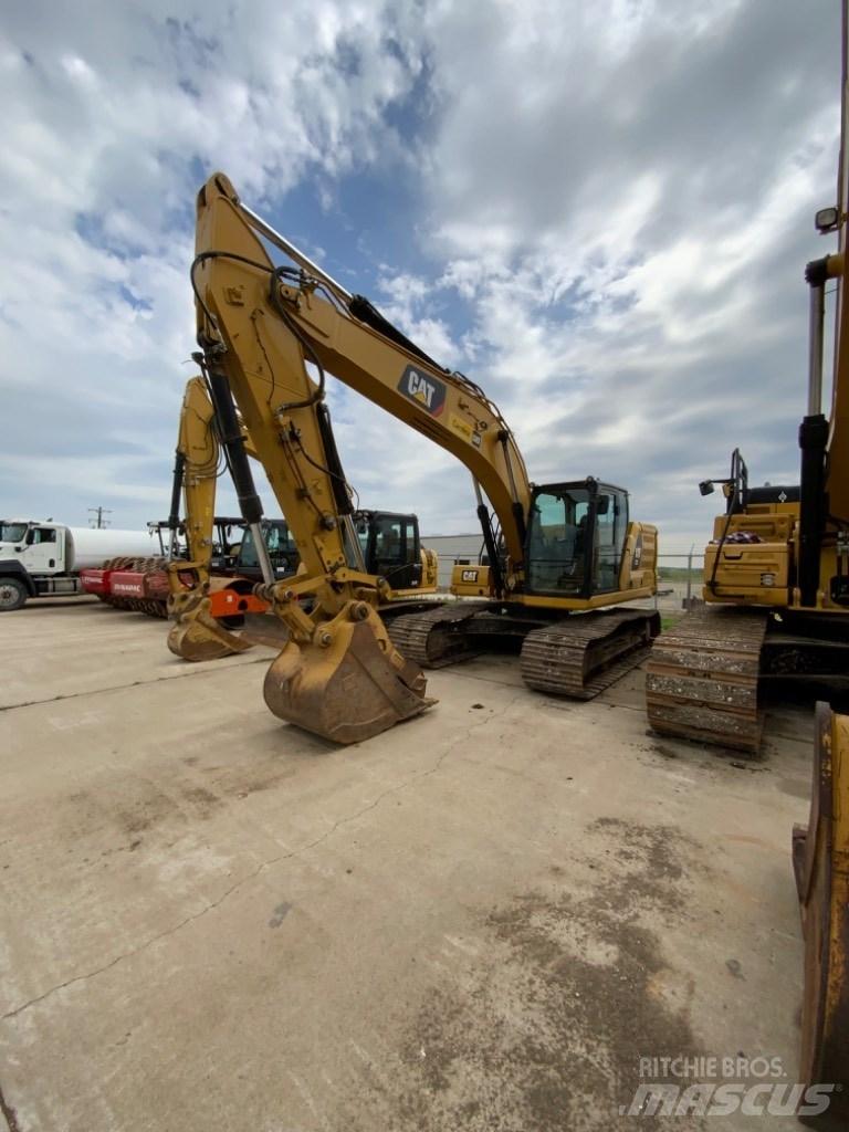 CAT 323 Гусеничні екскаватори