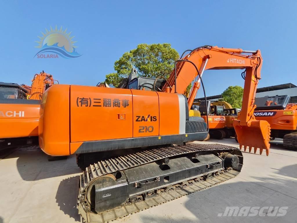 Hitachi ZX 210 Гусеничні екскаватори