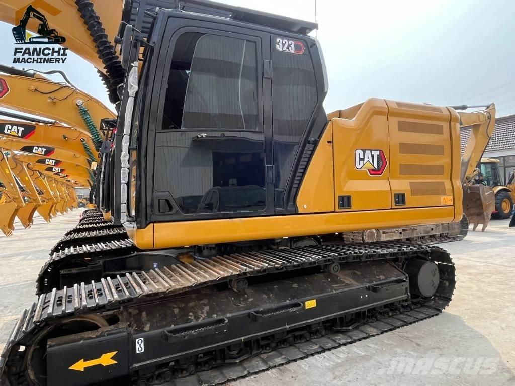 CAT 323 Гусеничні екскаватори