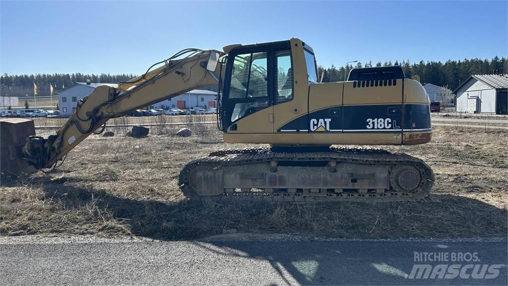 CAT 318 C Гусеничні екскаватори