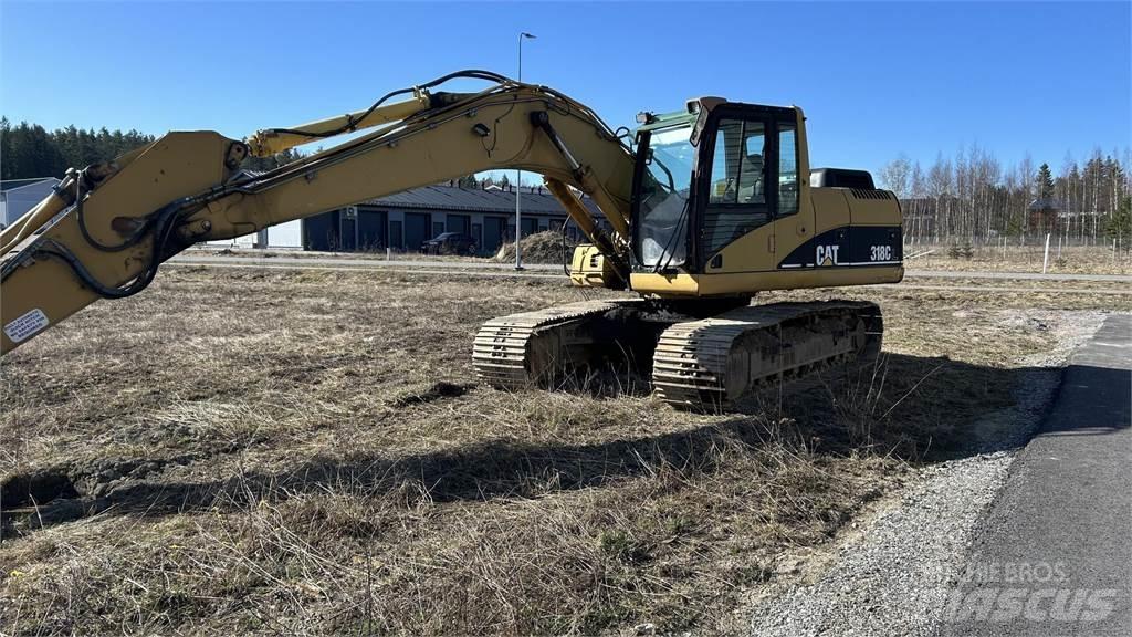 CAT 318 C Гусеничні екскаватори