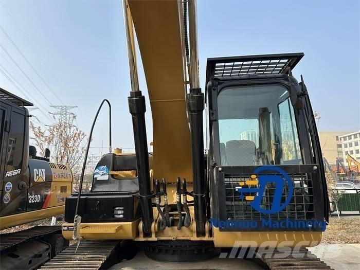 CAT 323D/323/323DL Гусеничні екскаватори
