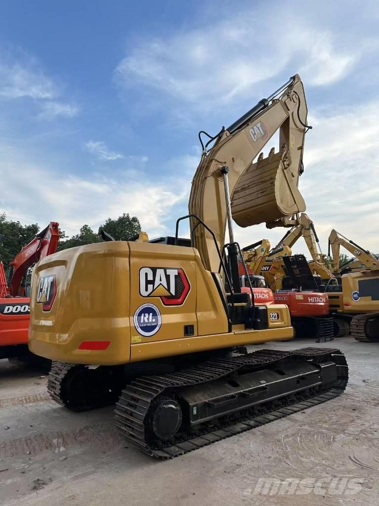 CAT 323 Гусеничні екскаватори