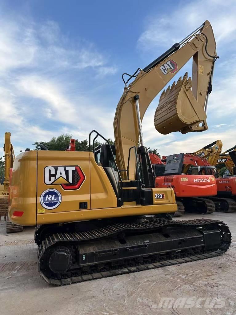 CAT 323 Гусеничні екскаватори