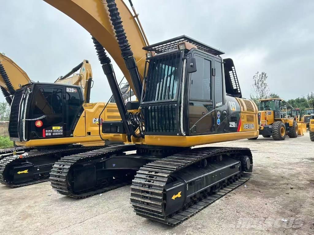 CAT 329 Гусеничні екскаватори