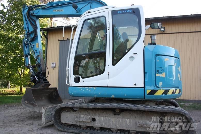  New Hollan E 70 BSR Середні екскаватори 7т. - 12т.