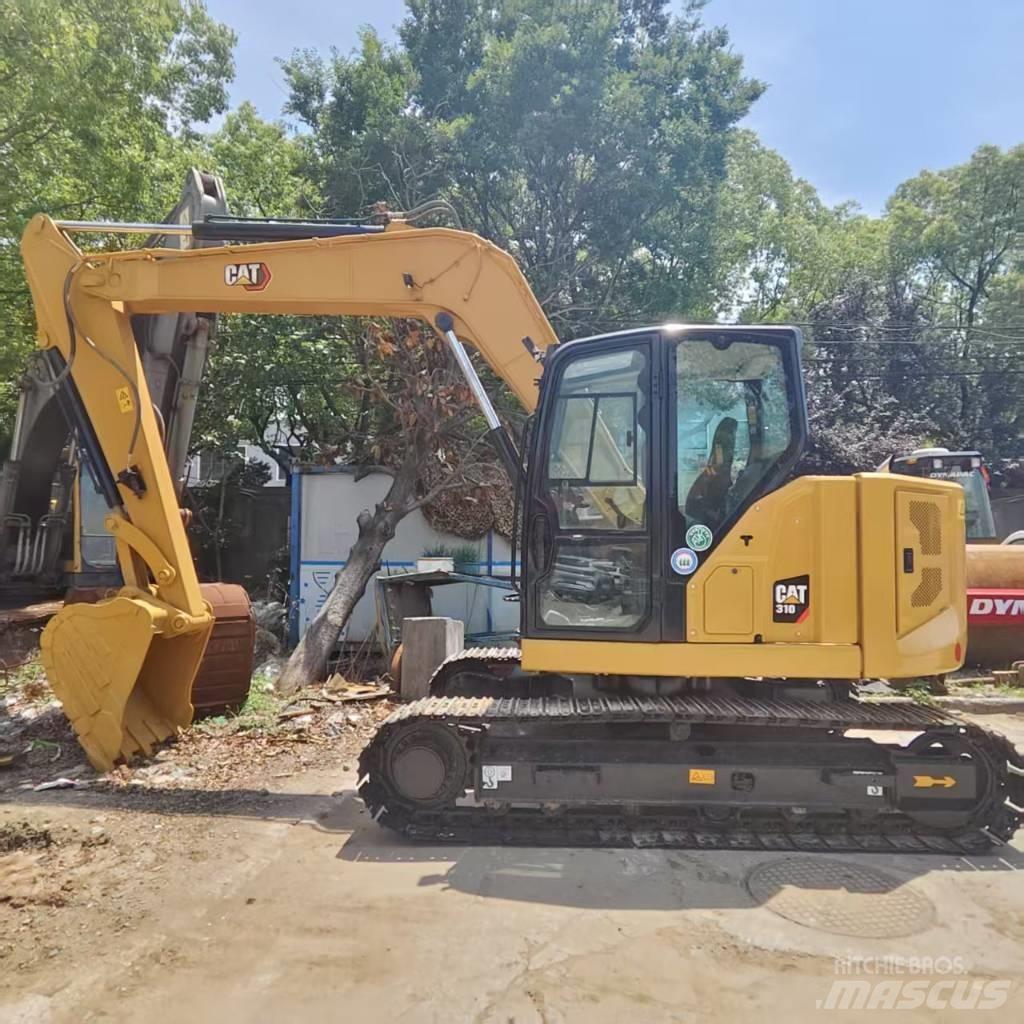 CAT 310 Середні екскаватори 7т. - 12т.