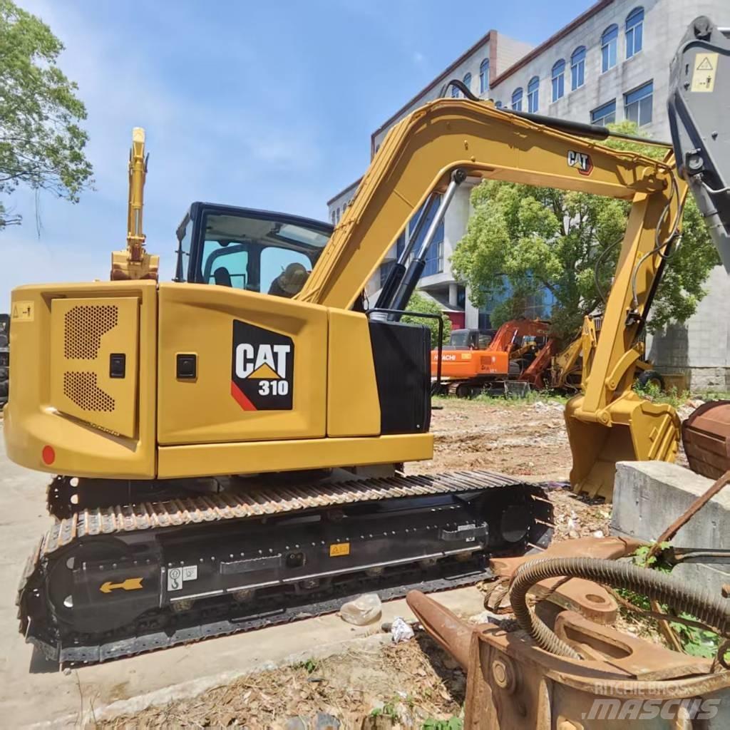CAT 310 Середні екскаватори 7т. - 12т.