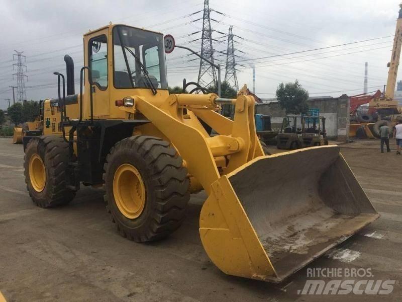 Komatsu WA 320 Екскаватори-навантажувачі