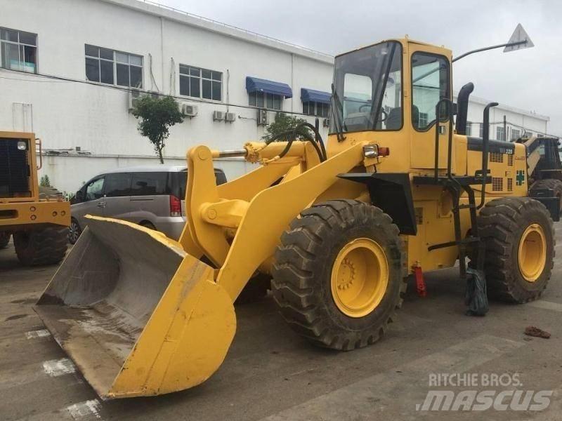 Komatsu WA 320 Екскаватори-навантажувачі
