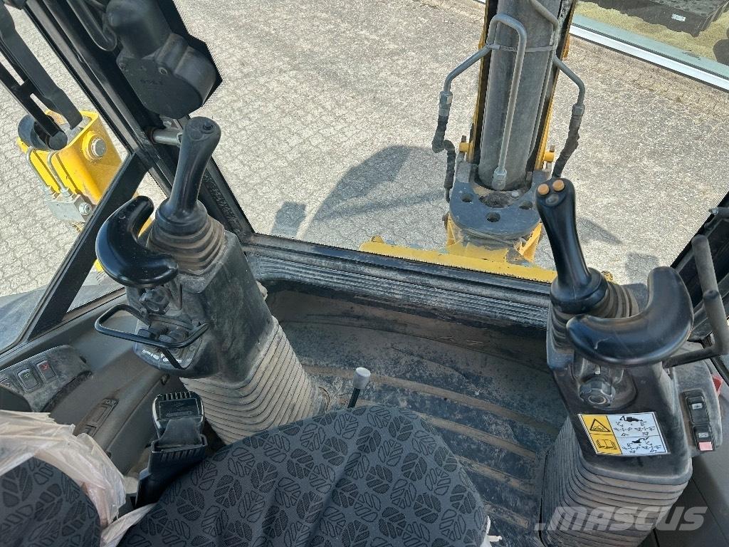 New Holland B 100 C Екскаватори-навантажувачі
