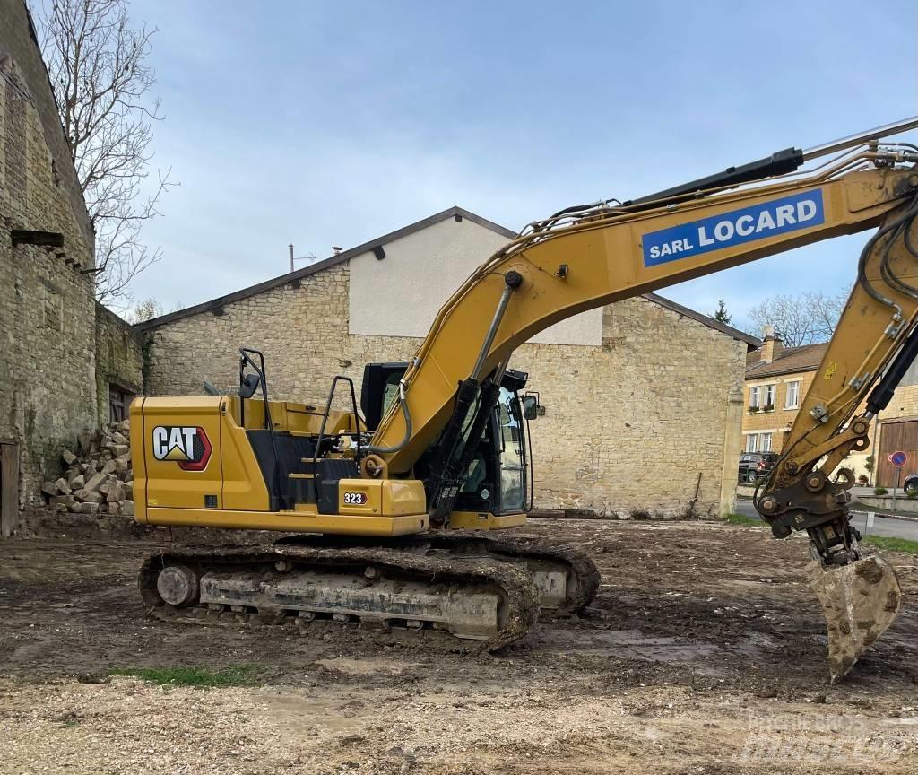 CAT 323 Гусеничні екскаватори