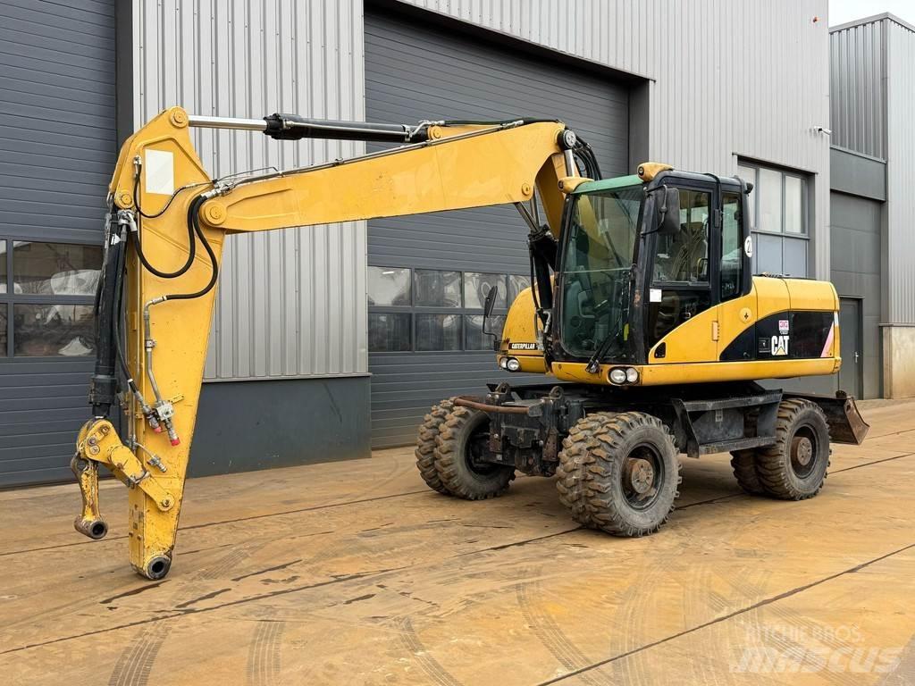 CAT M315D Колісні екскаватори